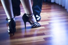 Tango dancer feet on dancefloor